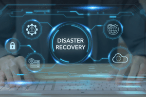 Hands typing on a keyboard with a futuristic digital overlay highlighting 'Disaster Recovery' in the center, surrounded by icons representing cybersecurity, cloud storage, global connectivity, and system alerts. The image emphasizes the importance of Disaster Recovery Planning for businesses to prepare for unexpected disruptions.