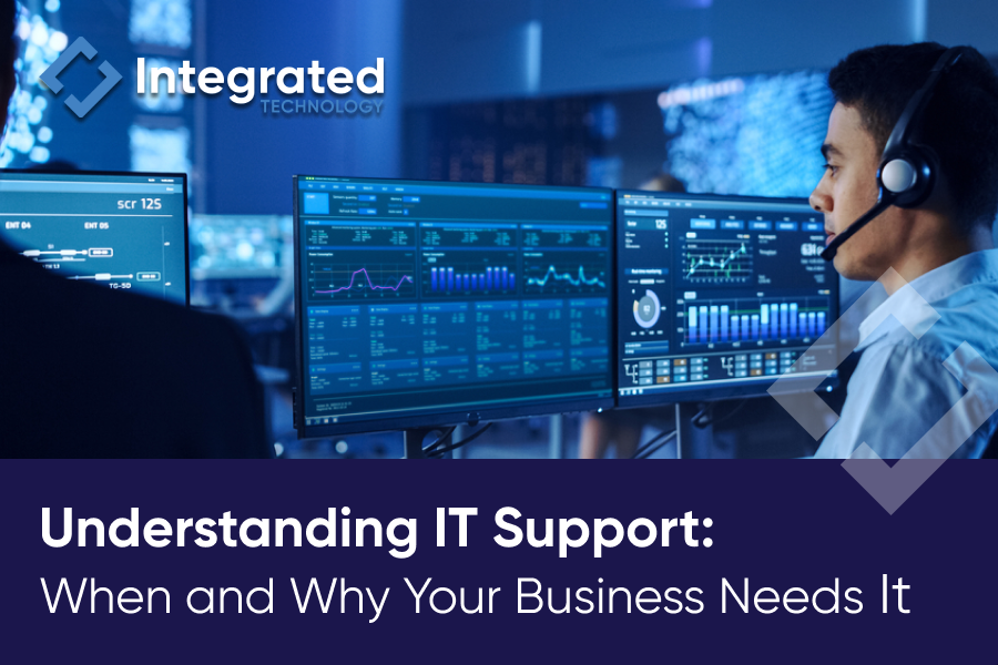 IT support specialist wearing a headset monitors multiple data dashboards in a high-tech operations center, with the text 'Understanding IT Support: When and Why Your Business Needs It' displayed—highlighting the importance of IT Support for business operations.